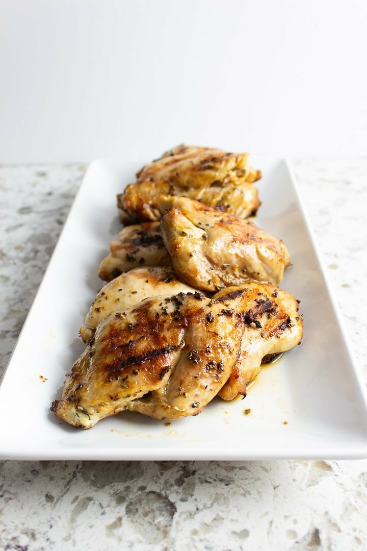 AIP Lemon Basil Grilled Chicken on a white serving platter.