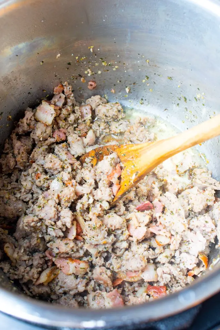 Browned bacon and ground pork in an Instant Pot.