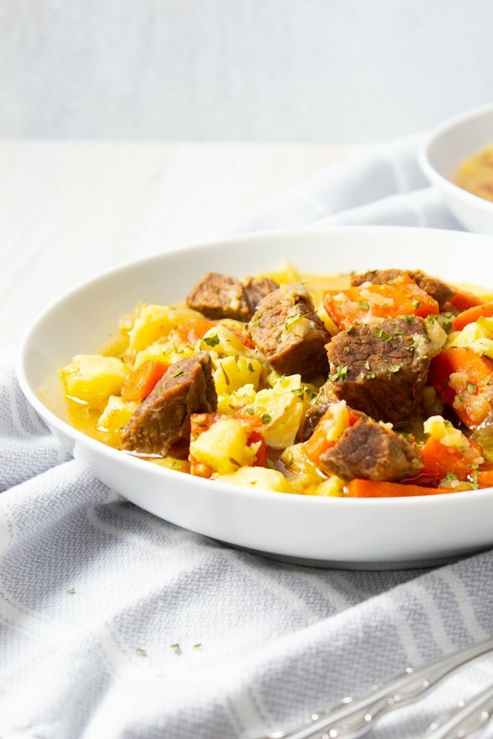 Close up of AIP Irish Beef Stew in a white bowl.