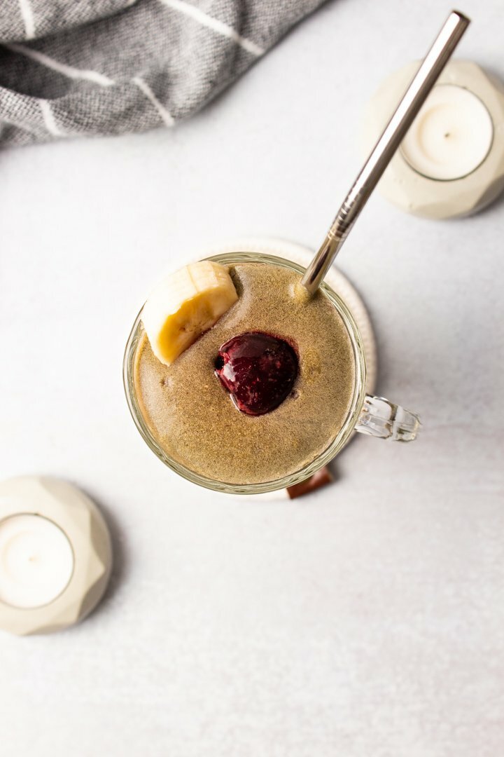 Top view of Cherry Banana Smoothie with a concrete background.